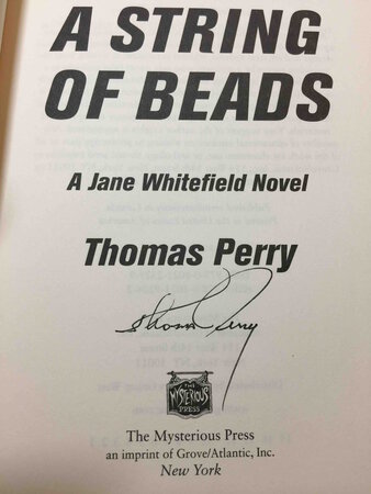 A STRING OF BEADS. by Perry, Thomas.
