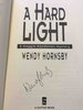 Another image of A HARD LIGHT: A Maggie MacGowen Mystery. by Hornsby, Wendy.