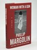 Another image of WOMAN WITH A GUN. by Margolin, Phillip.